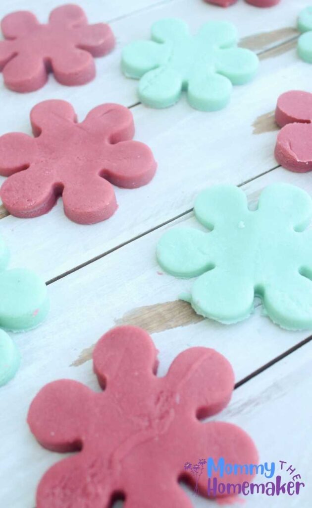 picture of several blue and pink 'flowers' made from playdough