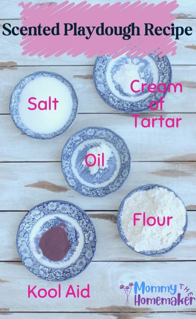 picture of 5 small bowls with different ingredients in each containing flour, salt, cream of tartar, oil, and kool aid