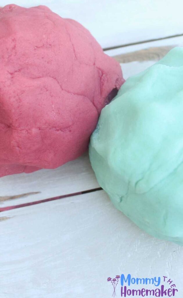 two batches of playdough, pink and blue